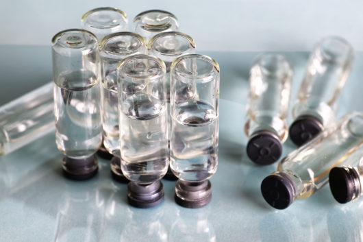 transparent vials of hyaluronic acid